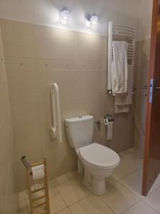 a bathroom with a toilet and a phone on the wall at Dom na Wynajem Gdynia Grabówek in Gdynia +27 photos