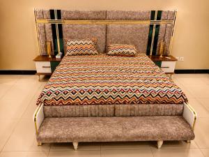 a bedroom with a bed with a blanket on it at Guest Villa in Lāsezai