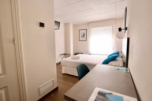 a room with a bed and a table and chairs at Hotel Universal Murcia in Murcia +66 photos