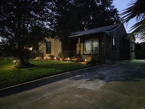 a house with a driveway in front of a yard at 21 Cozy Home in the Heart of the City in Stockton