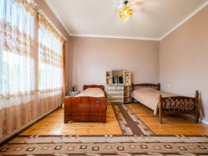 a bedroom with a bed and a large window at panorama lasuriashi in Lasuriashi