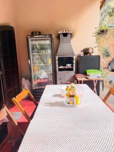 a table with bottles of orange juice on top at Sítio Sombra da Figueira in Paty do Alferes