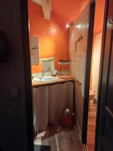 a small bathroom with a sink and a toilet at Loft 5 personnes dans ferme provençale in Ongles