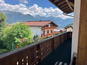 a balcony of a house with a view of mountains at Haus Alpenblick in Serfaus