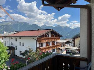 a view from a balcony of a town with mountains at Haus Alpenblick in Serfaus