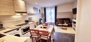 a kitchen with a table and chairs in a kitchen at Garaztegia Studio in Ustaritz