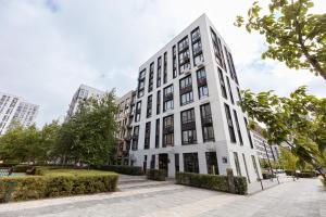 a white building with black windows at Fayna Town Comfort #2 in Kyiv