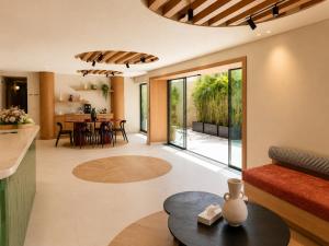 a living room with a table and a dining room at NOMA New Cairo in New cairo