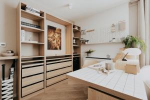 a room with a desk with a dog sitting on it at Saturn Studio by Navie Stays in Poole