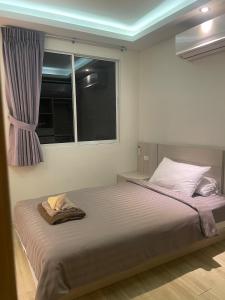a bedroom with a large bed with a window at Le Grand Bleu in Koh Samui +32 photos