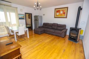 a living room with a couch and a wood stove at Medo in Novigrad Istria
