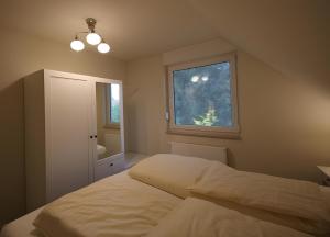 a bedroom with two beds and a window at Roter Blitz 2 k108 in Röbel