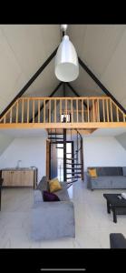 a living room with a loft bed and a couch at Valdiz in Zahlé +28 photos