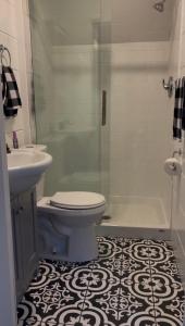 a bathroom with a toilet and a sink and a shower at Hidden Getaway in Pembroke +33 photos