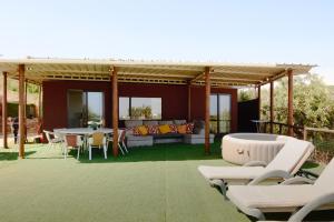 a patio with a table and chairs and a table and chairs at The Place in Albufeira +44 photos