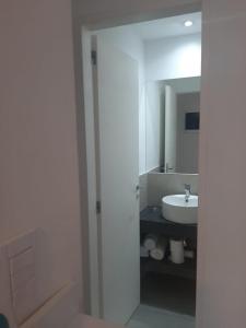 a bathroom with a shower and a sink at Spa vacacional in Mar del Plata +10 photos