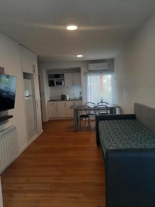 a living room with a couch and a dining room at Spa vacacional in Mar del Plata