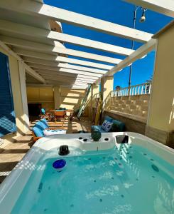 a hot tub on the balcony of a house at Blu Suite Ostia in Lido di Ostia