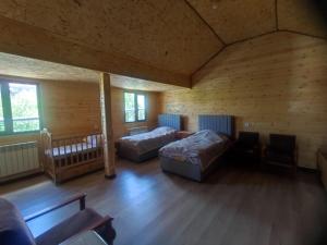 a large room with two beds and a couch at Eva Guesthouse in Odzun