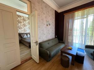a living room with a couch and a table at Lukas's house in Kobuleti