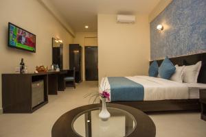 Krevet ili kreveti u jedinici u okviru objekta Tuki Resort Pokhara