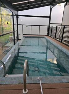 a swimming pool in a building with at DoubleTree by Hilton Caracol Canela in Canela