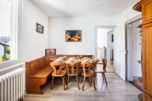 a dining room with a wooden table and chairs at -New- Colmar, Parking, Comfort, Spacious in Ingersheim
