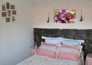 A bed or beds in a room at Apartamentos Rurales Azabal