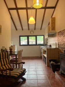 a kitchen with a table and chairs in a room at Casa Goyo in Viego