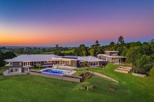 an aerial view of a house with a swimming pool at Byron Retreat in Coopers Shoot