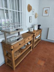 a kitchen with a wooden counter and a window at Le Castelas - Hébergement complet in Aurons
