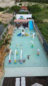 a large water park with people playing in it at Villa do Sol - Icaraí de Amontada in Icaraí