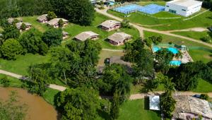 an aerial view of a house with a river at Hotel Fazenda Morada Do Verde in Campo Limpo