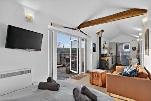 a living room with a tv and a couch at 1 Bed in Belford oc-cn002 in Lucker