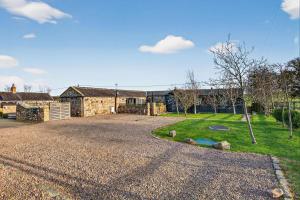 a house with a gravel driveway in front of a yard at 1 Bed in Belford oc-cn002 in Lucker