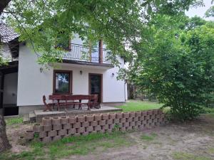 a house with a picnic table in front of it at Dom nad Morzem 79 in Stegna