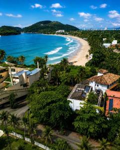 an aerial view of a beach and houses at Savay Hotel Boutique - Guarujá in Guarujá