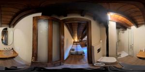 a room with a large mirror in the middle of a room at Hostería La Antigua in Potes +40 photos