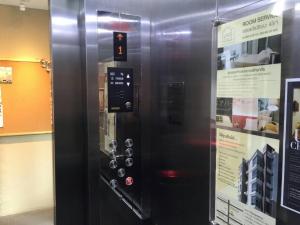 a black vending machine is next to a sign at U431 Chaengwattana in Nonthaburi