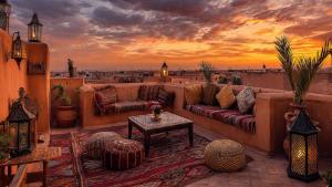 a living room with couches and a view of a city at Chambre d'hôte in Midelt