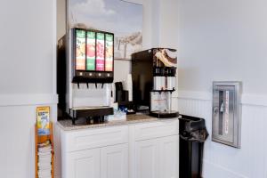 a kitchen with a counter with a coffee machine at Bonita Beach Hotel in Ocean City