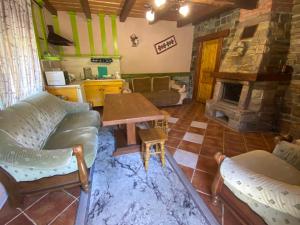 a living room with a couch and a fireplace at Ребровач in Tatariv