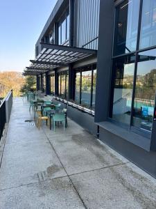 a row of tables and chairs outside of a building at Midrand Stylish 1Bedroom Escape in Midrand