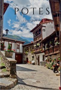 a magazine cover of a building with flowers on the balconies at Hostería La Antigua in Potes