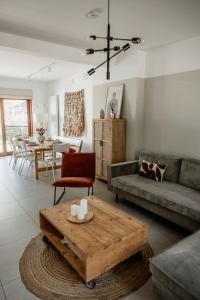 a living room with a couch and a coffee table at Vakantiewoning Spoor 23 in Borgloon