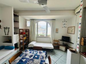 a room with two beds and a window at Salsedine - Immobilevante in Ponza