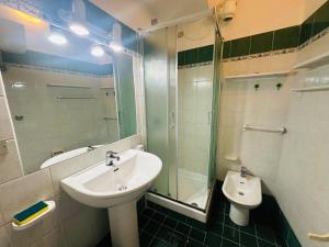 a bathroom with a sink and a shower and a toilet at Salsedine - Immobilevante in Ponza +29 photos