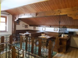 a dining room with a bar and a balcony at Haus Anneliese in Gröbming