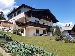 a house with a garden in front of it at Haus Anneliese in Gröbming