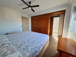 a bedroom with a bed and a ceiling fan at Alma Andaluza Apart 1 in Mairena del Aljarafe +10 photos